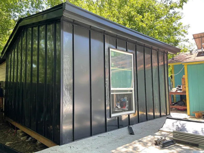 Black standing seam metal wall panels for Roof Inspection in Upper Deerfield