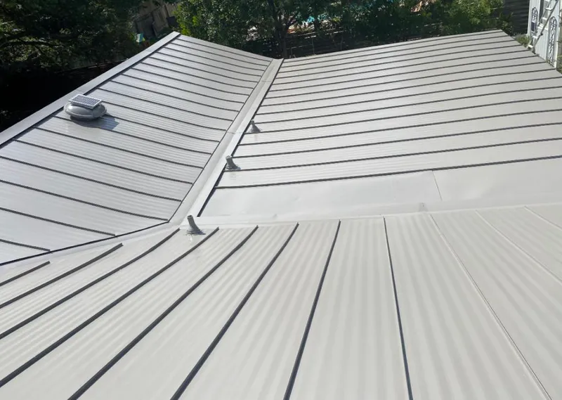 Solar attic fan installed on a metal roof for Roof Ventilation in Upper Deerfield